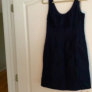 Navy sleeveless dress with cinched waist